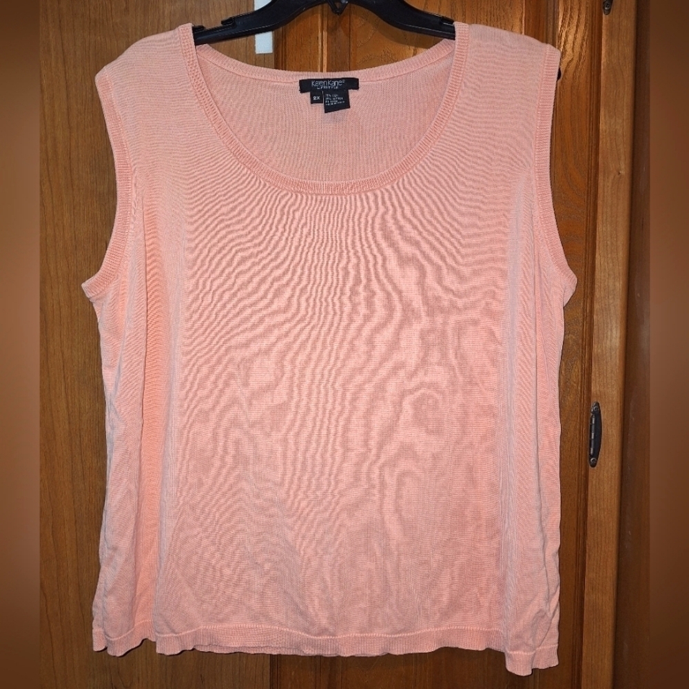 A Karen Kane sleeveless silk and cotton top in a size 2XL. Fuzzy Peach color.
